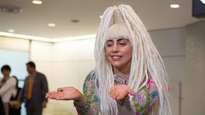 US singer Lady Gaga poses upon her arrival at Narita International Airport in Chiba prefecture, east of Tokyo, Japan, August 12, 2014. Lady Gaga is on her world ArtRave:The Artpop Ball tour and will performan in Tokyo twice. EPA