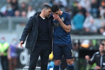 Sergio Conceicao gives instructions to Mehdi Taremi during their spell together at Porto. EPA