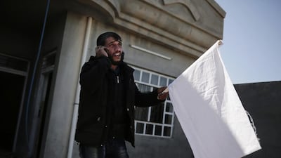 A civilian who escaped ISIL territory phones his family he left behind on February 21, 2017 in Abu Saif, Iraq. Iraqi forces advanced into the southern outskirts of Mosul in a push to drive ISIL militants from the city’s western half. Bram Janssen/ AP Photo