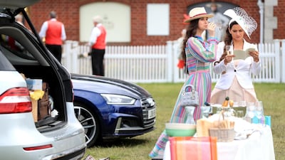 Racegoers during ladies day. PA