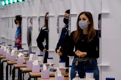 Students from the University of St Andrews wait to take a coronavirus test. AFP