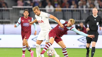 PERTH, AUSTRALIA - JULY 18: Harry Kane of Tottenham and Flynn Downes of West Ham tussle for the ball during the pre-season friendly match between Tottenham Hotspur and West Ham United at Optus Stadium on July 18, 2023 in Perth, Australia. (Photo by James Worsfold / Getty Images)