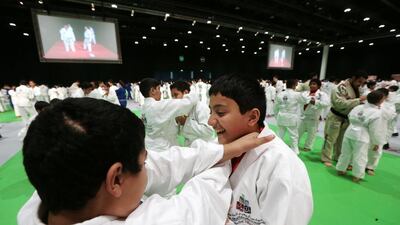 Students from Abu Dhabi Education Council schools attempt to break the world record for the largest jiu-jitsu class at the Abu Dhabi National Exhibition Centre. Christopher Pike / The National