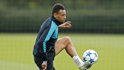 Arsenal's Francis Coquelin plays with the ball on Monday at the team's training session ahead of their Champions League match on Tuesday. John Sibley / Action Images / Reuters