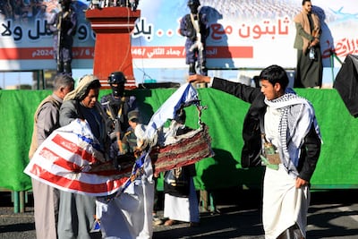 A US flag is burned during a demonstration in solidarity with the people of Gaza in the Houthi-controlled capital Sanaa. AFP