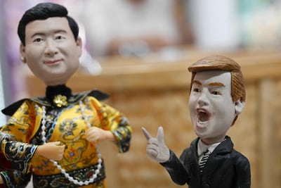 Figures depicting Xi Jinping and Donald Trump on sale in a store in Beijing. AFP