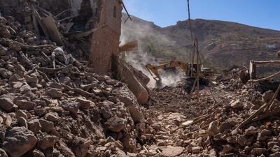 An excavator digs through the rubble of collapsed buildings in Douzrou, Morocco. Getty Images