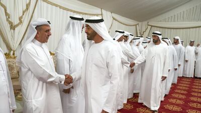 Sheikh Mohamed bin Zayed, Crown Prince of Abu Dhabi and Deputy Supreme Commander of the UAE Armed Forces, offers condolences to the family of Abdullah bin Mohammed Al Hashemi. Seen with Mohamed Al Mazrouei, Undersecretary of the Crown Prince Court of Abu Dhabi (back R). Hamad Al Kaabi / Ministry of Presidential Affairs