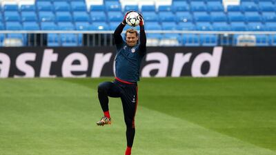 Goalkeeper Manuel Neuer makes a save during their FC Bayern Muenchen training at the Santiago Bernabeu Stadium ahead of the UEFA Champions League semi-final first leg match against Real Madridon April 22, 2014 in Madrid, Spain. Martin Rose/Getty Images