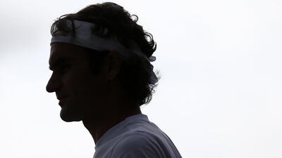Roger Federer is pictured during a training session on Saturday for Sundays 2014 Wimbledon men's singles final. Andrew Cowie / AFP