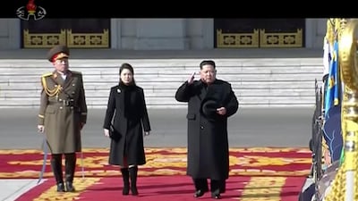 Kim Jong Un inspects honour guards, along with his wife Ri Sol Ju, center, during a military parade in Pyongyang, KRT / AP