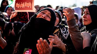 Relatives mourn at a funeral for two Syrian Democratic Forces (SDF) fighters in the Syrian Kurdish-majority city of Qamishli, after they were killed by a Turkish military drone, according to Kurdish security officials. AFP