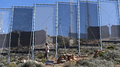 A Moroccan man inspects fog fences in a hamlet on the outskirts of the southern coastal city of Sidi Ifni, on June 7, 2015. Fadel Senna/AFP Photo