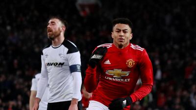 Manchester United's Jesse Lingard celebrates scoring the opening goal against Derby County. Jason Cairnduff / Reuters