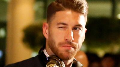 Real Madrid captain Sergio Ramos winks as he arrives. EPA