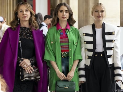 Emily, centre, wears a coat by Lebanese designer Elie Saab. Photo: Netflix