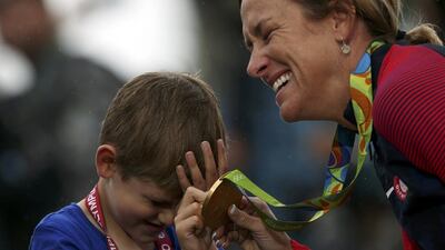 Kristin Armstrong (USA) of USA with her son. REUTERS/Matthew Childs
