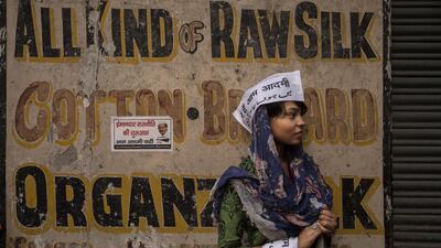 A Muslim supporter of the anti-corruption Aam Admi Party waits for a rally by its leader, Arvind Kejriwal, to pass through the Hindu holy town of Varanasi on May 9, 2014, the penultimate day of campaigning in India’s general election. Kevin Frayer / Getty Images