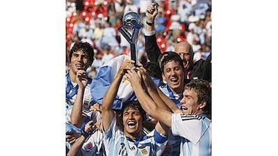 Argentina's Sergio Aguero, centre, holds up the Fifa Under 20 World Cup in Canada in 2007 after his side defeated the Czech Republic.