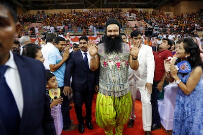Clashes between followers and police erupted outside court after the Indian spiritual guru who calls himself Saint Dr Gurmeet Ram Rahim Singh Ji Insan, centre, was found guilty of raping two women in 2002. Tsering Topgyal / AP Photo