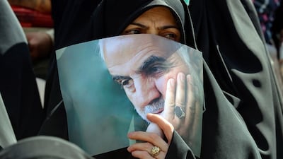 An Iranian carries a portrait of Qassem Suleimani, the former leader of the IRGC's Quds Force, at a gathering in Tehran last month. AFP