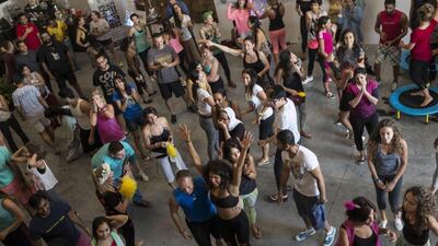 The early morning revellers called Sunrisers fill the A4 space and repurpose it as dance floor.