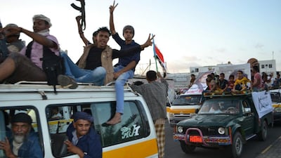 Yemenis celebrate in the Khormaskar area of Aden on December 17, 2015, after the rebels released hundreds of pro-government detainees as part of a prisoner swap. Mohammed Al Qalisi for The National