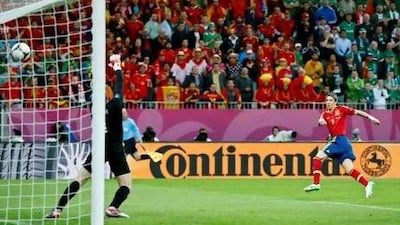 Fernando Torres beats Shay Given, the Ireland goalkeeper, to score Spain's first goal during their Group C match in Gdansk, Poland, last night. Matt Dunhan / AP Photo