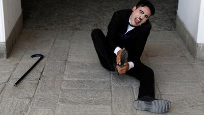 Karim Asir takes a tumble during rehearsals in Kabul. Reuters