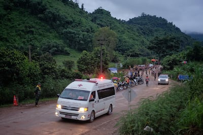 An ambulance carrying one of the boys rescued from the cave heads towards the hospital. Getty Images