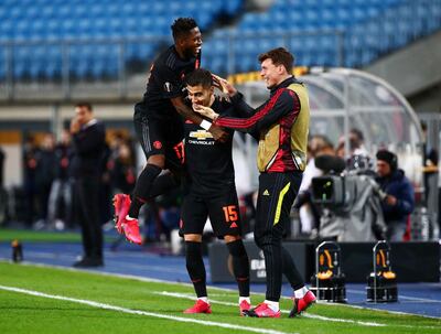 Manchester United's Andreas Pereira celebrates scoring their fifth goal with teammates. Reuters