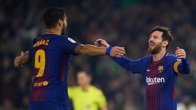 Lionel Messi, right, and Luis Suarez, were both on the scoresheet for Barcelona in their 5-0 win at Real Betis. Aitor Alcalde / Getty Images