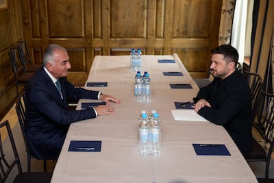 Ukraine's President Volodymyr Zelenskyy, right, meets Reza Pahlavi, Iran's former crown prince, in Munich. AFP