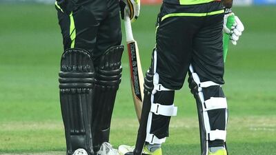 Lahore Qalanadars batsmen Sohail Akhtar, left, and Fakhar Zaman confer.