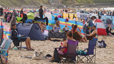Holidaymakers on Fistral Beach in Newquay, Cornwall. Getty
