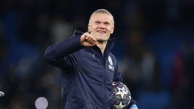 Erling Haaland with the match ball after scoring five goals for Manchester City against Leipzig in the Champions League. Reuters