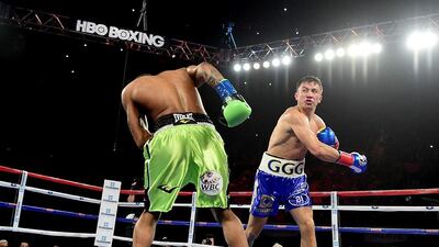 Gennady Golovkin of Kazakhstan punches Dominic Wade. Harry How / AP Photo