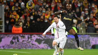 Paris Saint-Germain's Argentinian forward Lionel Messi vies with Lens' Ivorian midfielder Seko Fofana. AFP