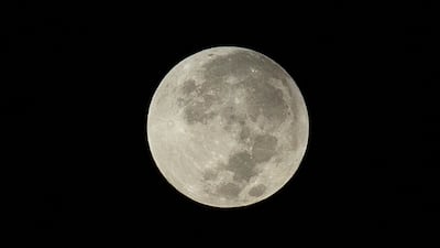 Wednesday's partial lunar eclipse and full supermoon as seen from Abu Dhabi. The National