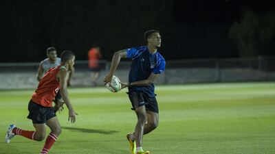 Hassan Al Noobi, centre, kicked the winning points for the Abu Dhabi Saracens. Antonie Robertson / The National