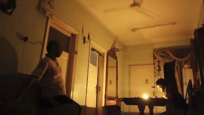 Mostafa Khaled studies by candlelight for his early morning exams during a power cut in Toukh, about 25 kilometres northeast of Cairo.