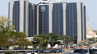 The Nigerian SEC and central bank are based in Abuja. The SEC investigated the two execs' firms. Reuters