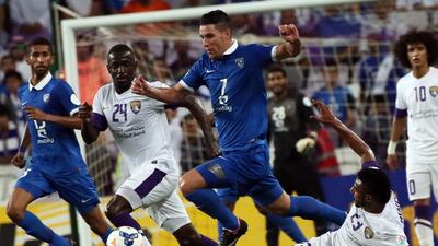 Saudi Arabia's Al Hilal midfielder Thiago Neves, centre, shown here against Al Ain last year, has agreed to terms with Al Jazira of the Arabian Gulf League. AFP PHOTO/KARIM SAHIB