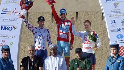 Italian Vincenzo Nibali, centre, of Astana Pro Team, Belgian Kenny Dehaes, left, and Australian Brendan Canty celebrate on the podium after the Tour of Oman on Friday. Eric Feferberg / AFP
