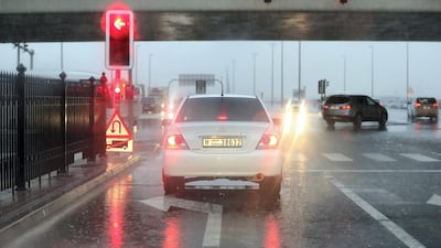 A driver waits at a junction in Dubai. Chris Whiteoak / The National