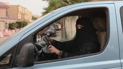 Aziza Yousef drives a car in Riyadh on March 29, as part of a campaign to defy Saudi Arabia's ban on women driving. Hasan Jamali / AP Photo