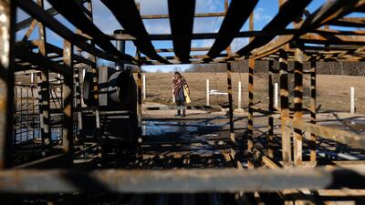 A migrant walks through the Lipa camp. AP Photo