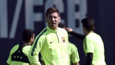 Lionel Messi stretched during training. Lluis Gene / AFP