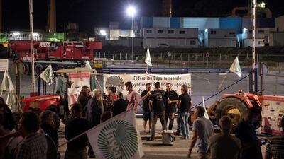 Farming union members demonstrate as they block the access of French oil giant Total's La Mede refinery in Chateauneuf-les-Martigues, southern France. AFP/BERTRAND LANGLOIS