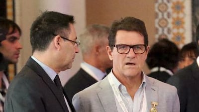Barcelona President Josep Maria Bartomeu, left, speaks with football manager Fabio Capello. Ashraf Mohammad / Reuters